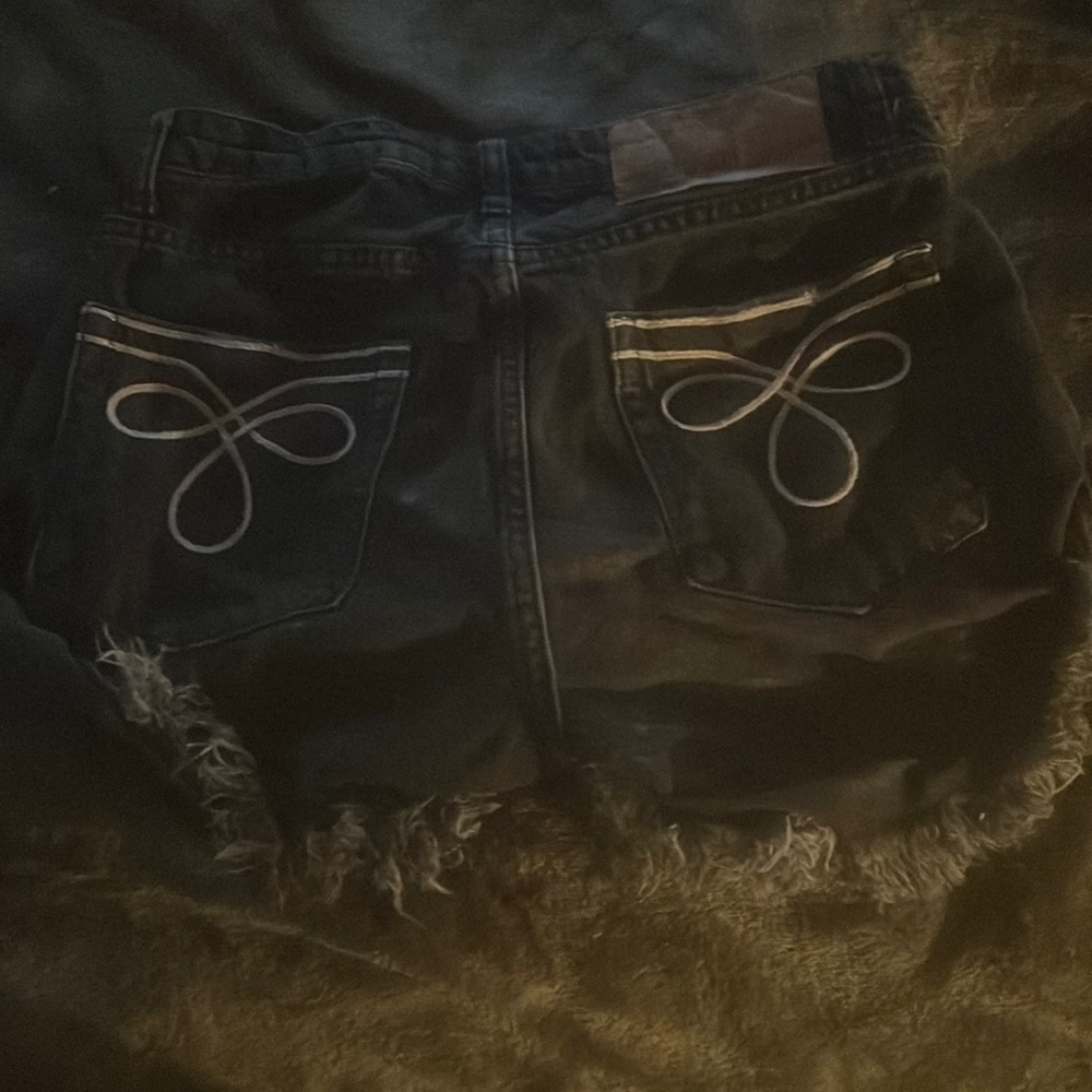 Distressed black jean shorts